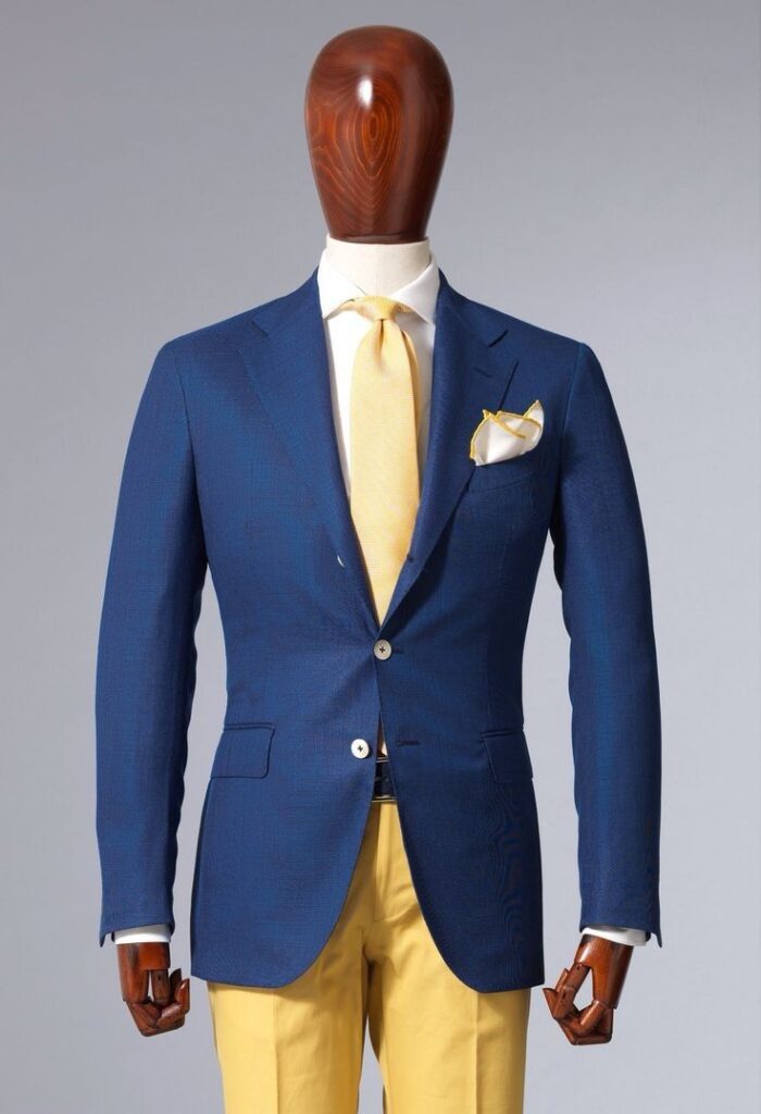 a blue suit with yellow pants and a white shirt